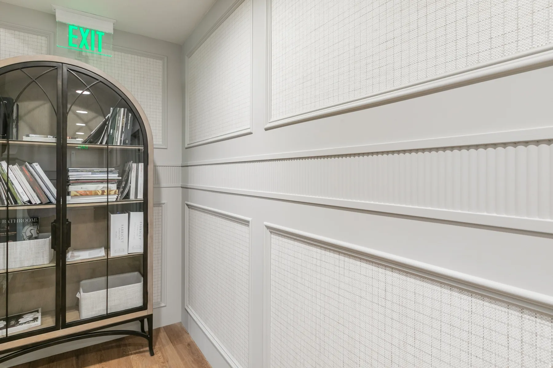 Wainscoting with decorative trim and textured wall covering