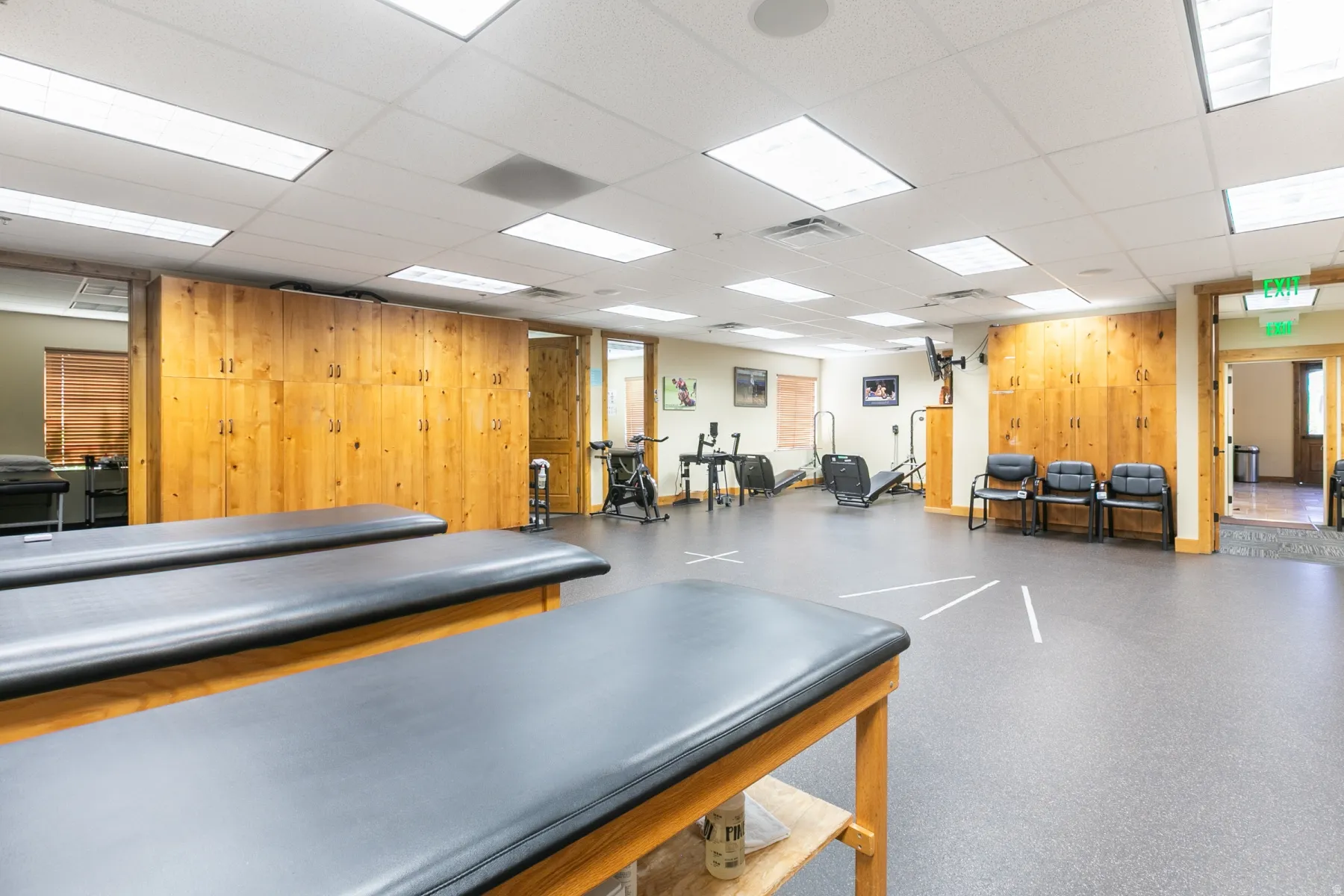 Spacious room with recessed lighting and acoustic ceiling tiles