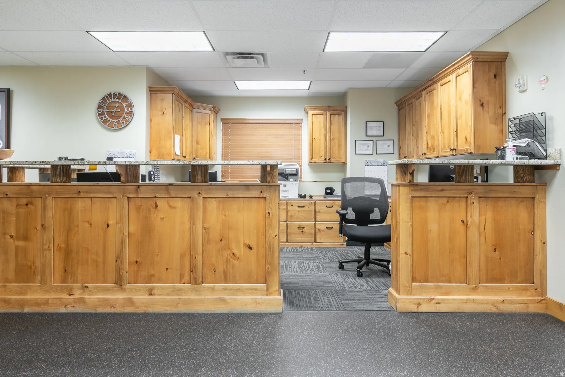 Built-in wood cabinetry with stone countertops