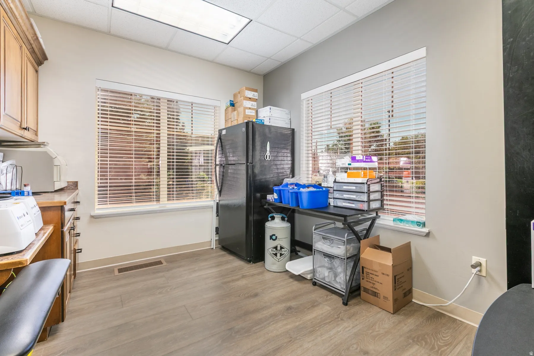 Wood-finish flooring with light neutral walls