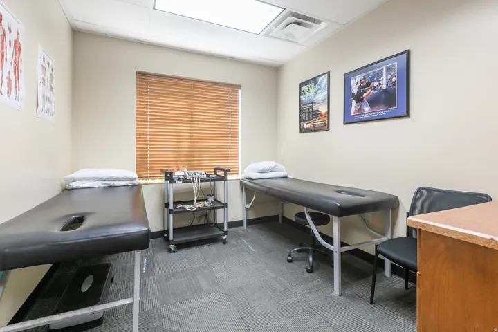 Window with horizontal blinds, neutral wall paint, recessed lighting, and patterned commercial-grade carpet