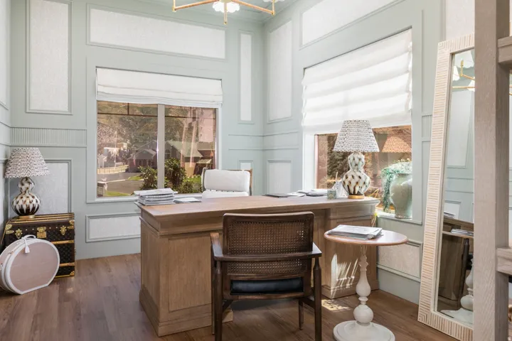 Wood-finish flooring with a large window featuring a custom shade