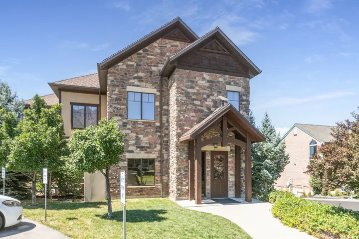 Stone and stucco exterior with multiple gables
