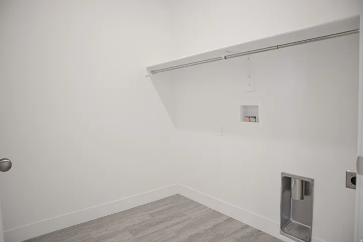 Full-size, dedicated laundry room.