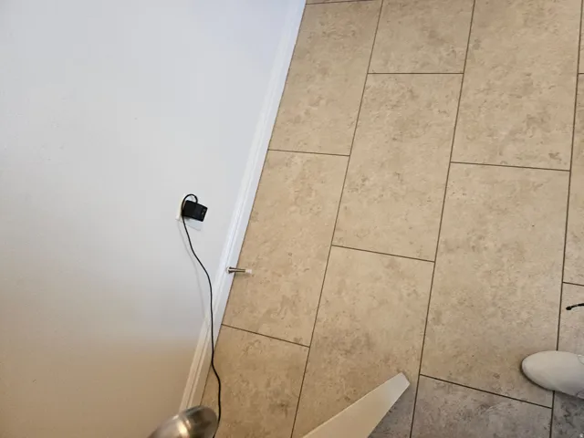 Neutral-toned tile flooring with contrasting grout