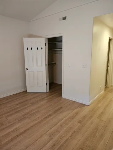 Vaulted ceiling with wood-finish flooring