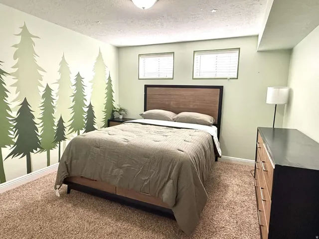 Wall-to-wall carpeting with light green painted walls