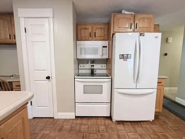Wood-finish flooring with light wood cabinetry
