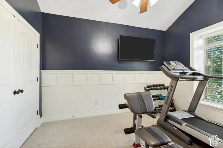 White paneled wainscoting and beadboard paneling with a dark accent wall