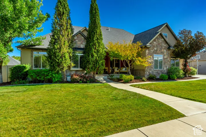 Stone veneer and stucco exterior with multiple windows