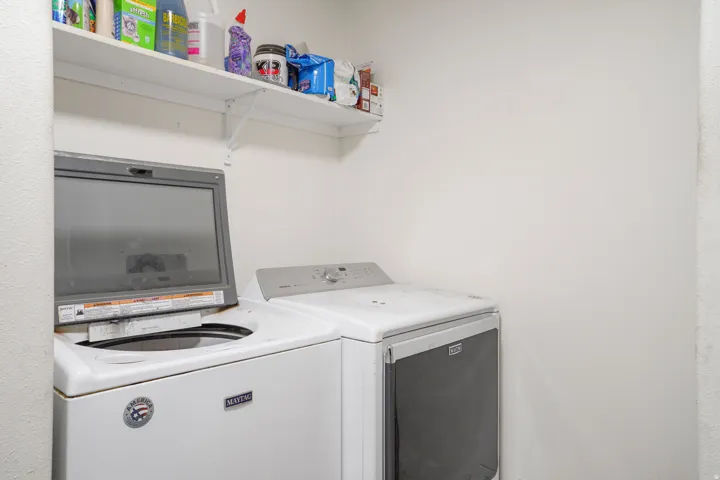 White wall shelving with bracket supports