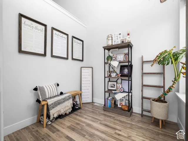 Wood-finish flooring with white wall trim
