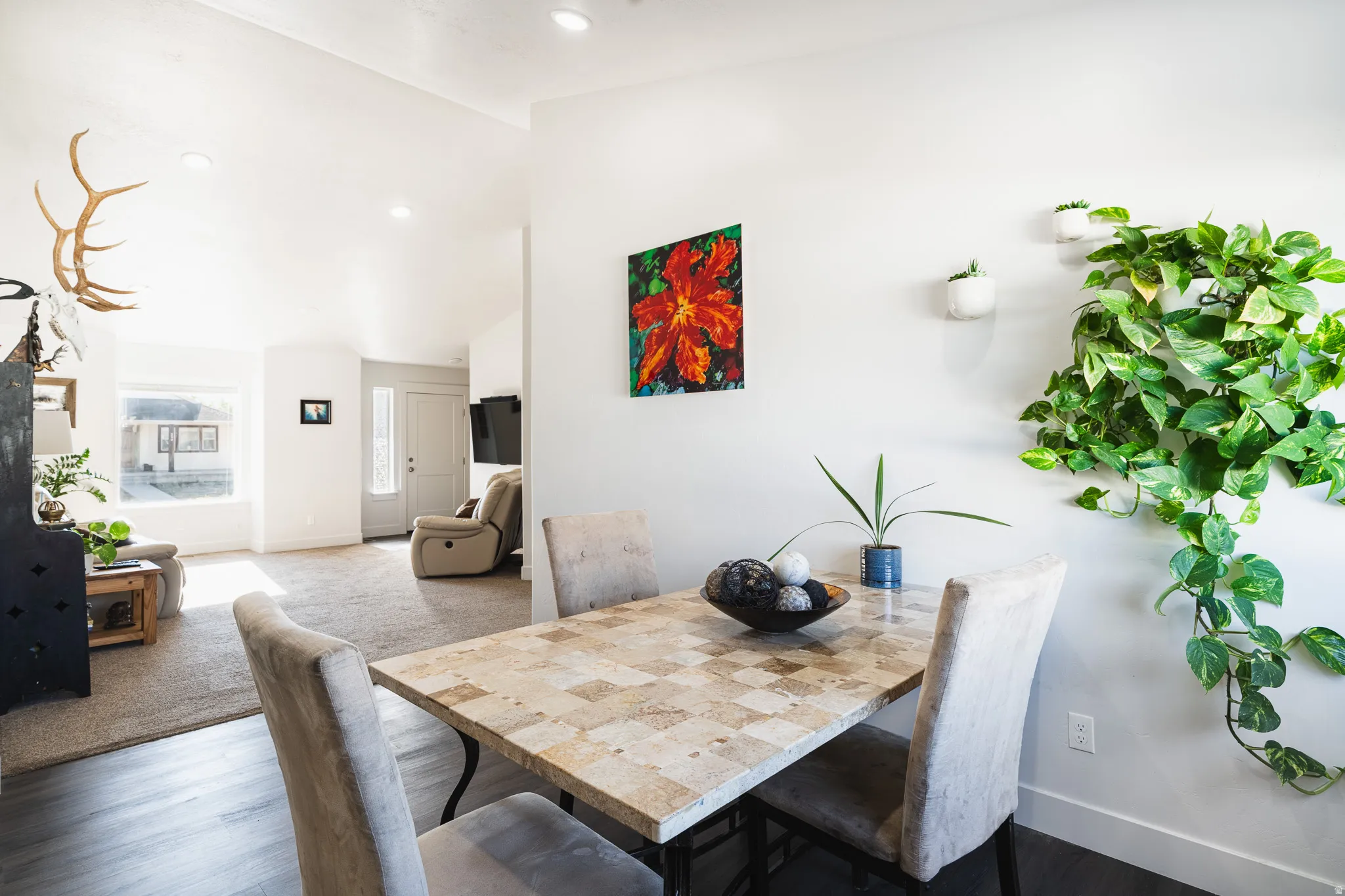 Dining area featuring a tiled surface dining table, recessed lighting, and dark wood-finish flooring
