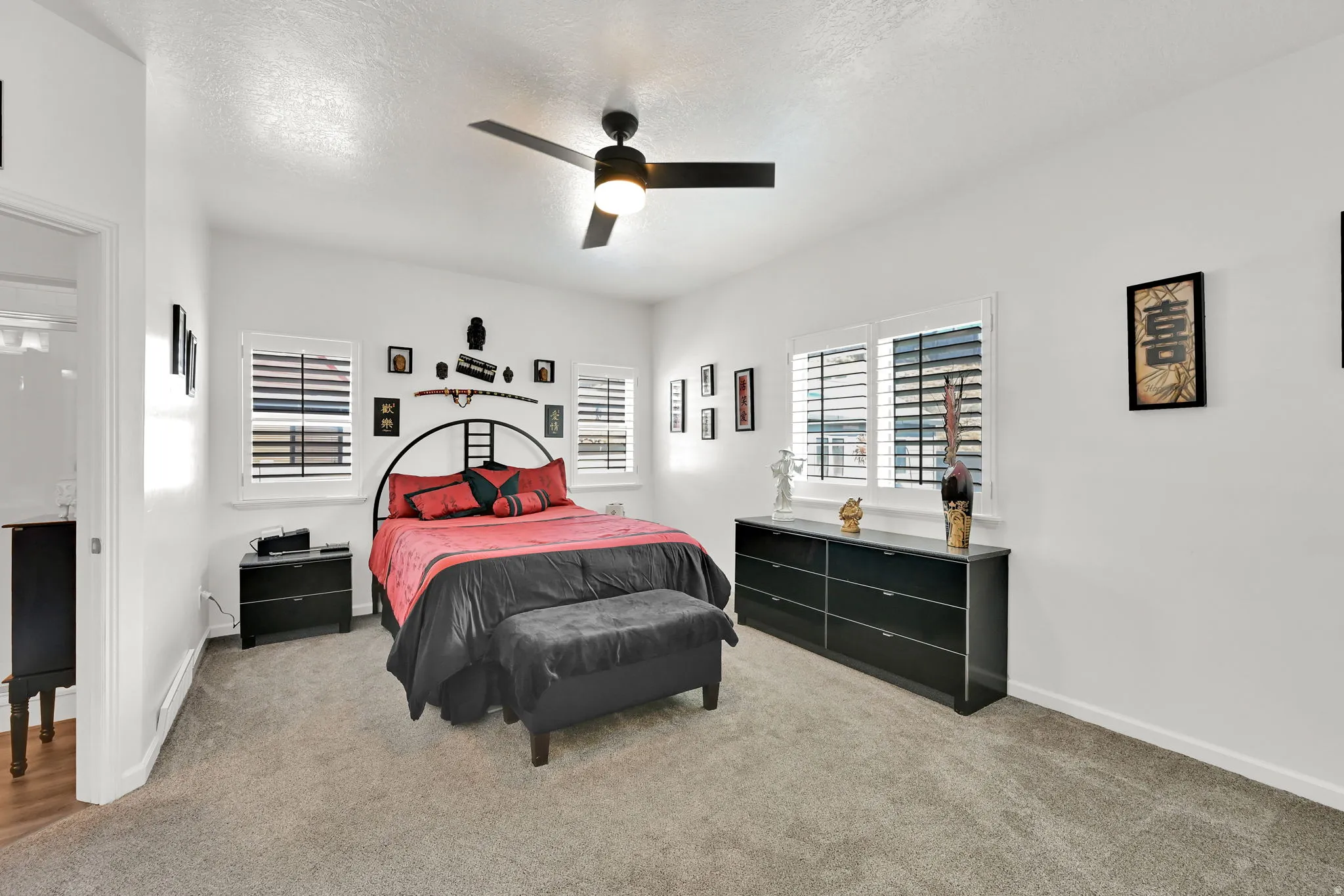 MASTER BEDROOM. Neutral wall paint, ceiling fan with integrated lighting, window shutters, and carpeted flooring