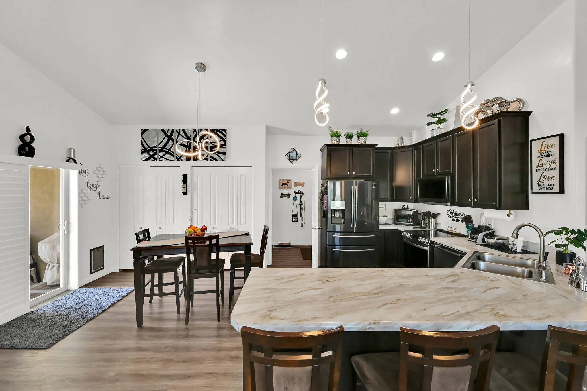 KITCHEN/DINING AREA. Wood-finish flooring throughout