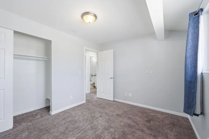 Wall-to-wall carpeting and neutral wall tones