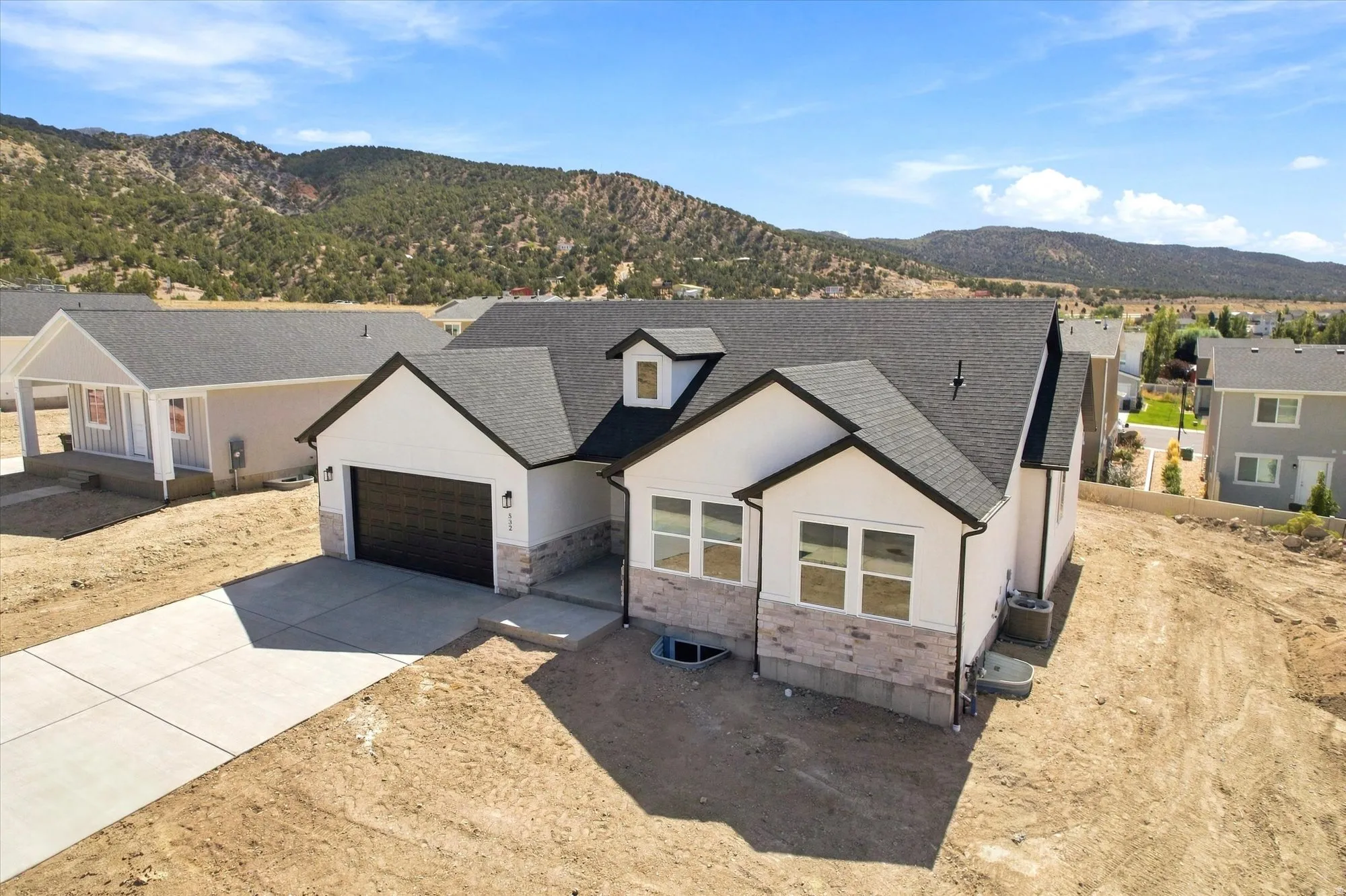 Contemporary single-story residence with a dark asphalt shingle roof