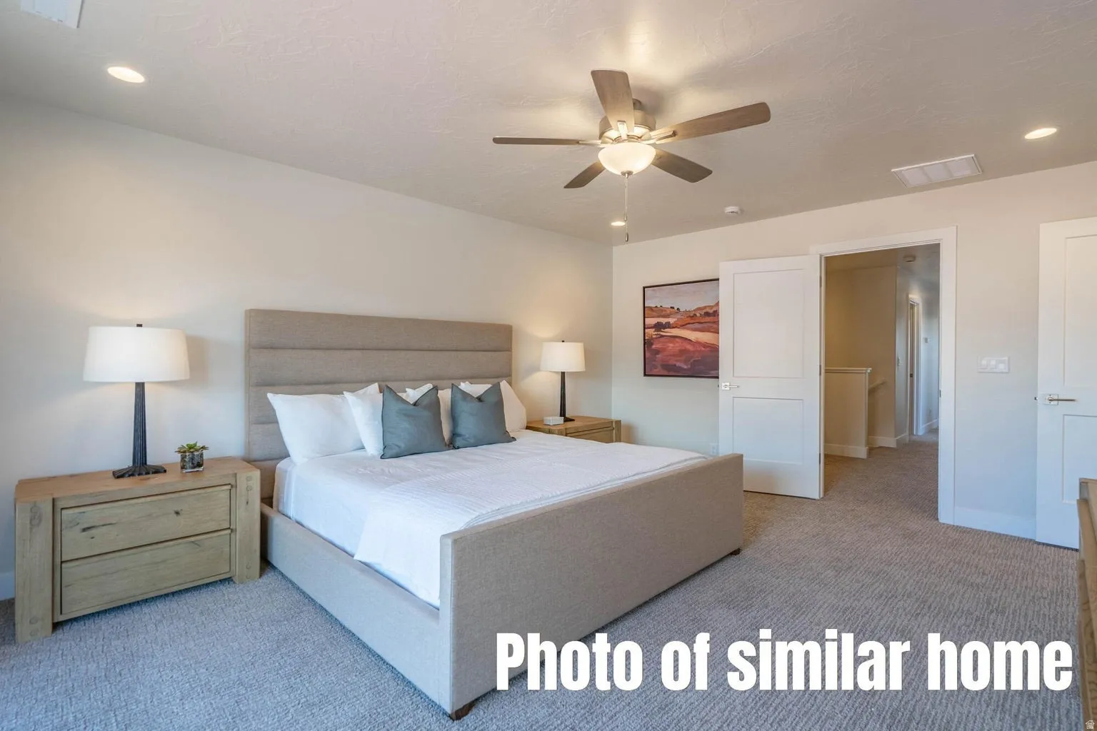 Vaulted ceiling featuring a ceiling fan, recessed lighting, and soft gray carpeting