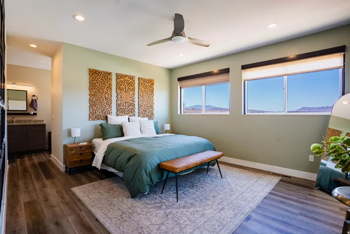 Recessed lighting with a ceiling fan, wood-finish flooring, and large windows with integrated blinds