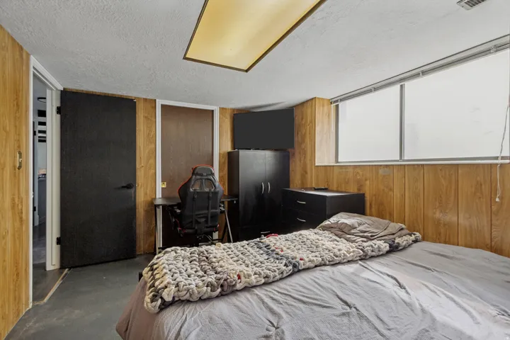 Textured ceiling with a rectangular flush-mount light fixture