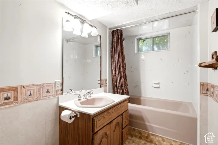 Wood-finish vanity with a single basin sink