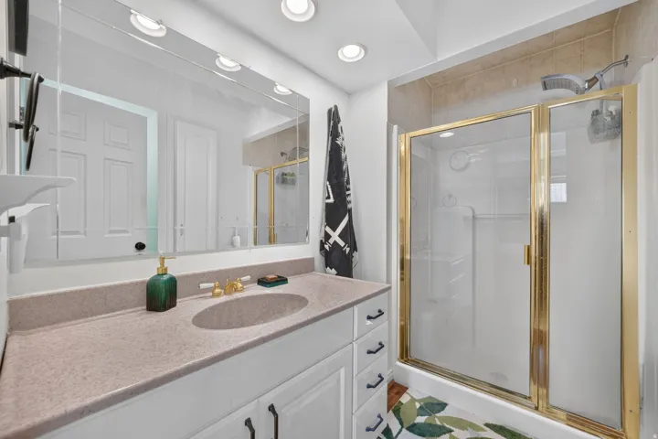 Double vanity with an integrated sink and light-colored countertop