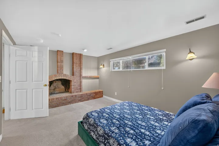 Recessed lighting, baseboard molding, and wall-mounted sconces