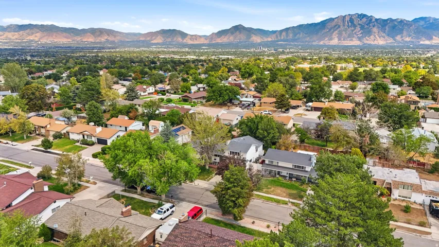 Established neighborhood with mature trees and mountain backdrop