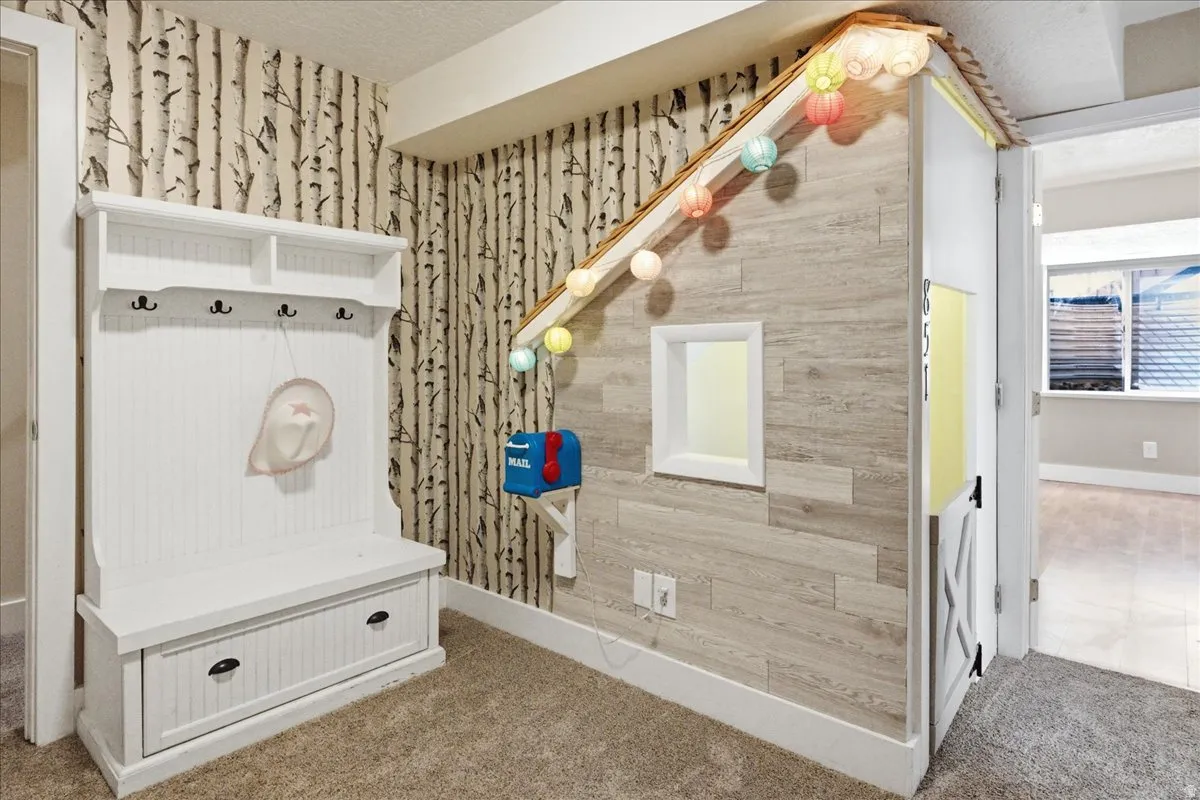 Wall-mounted coat rack and bench with integrated storage