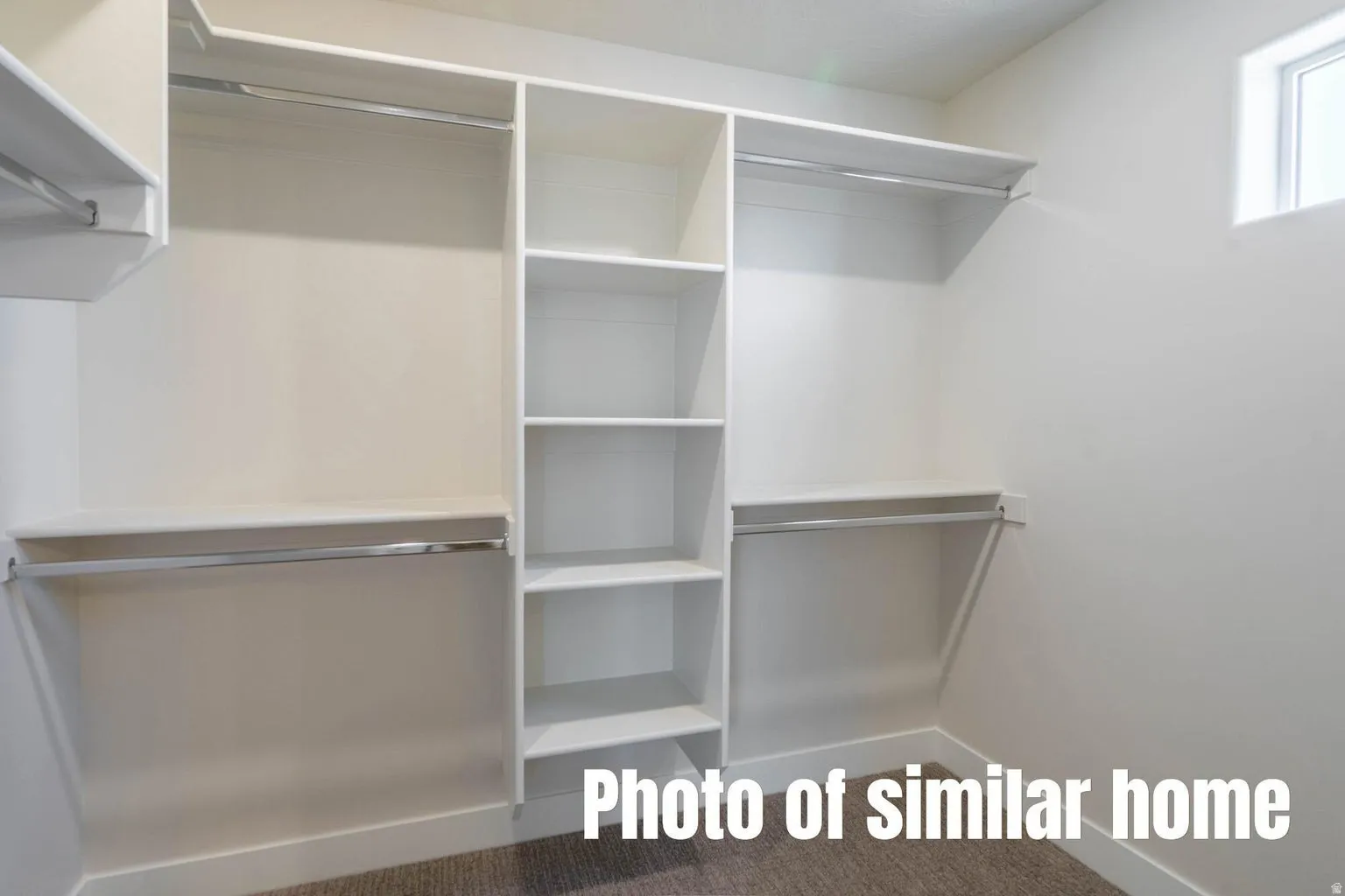 Built-in closet organization system with shelving and hanging rods