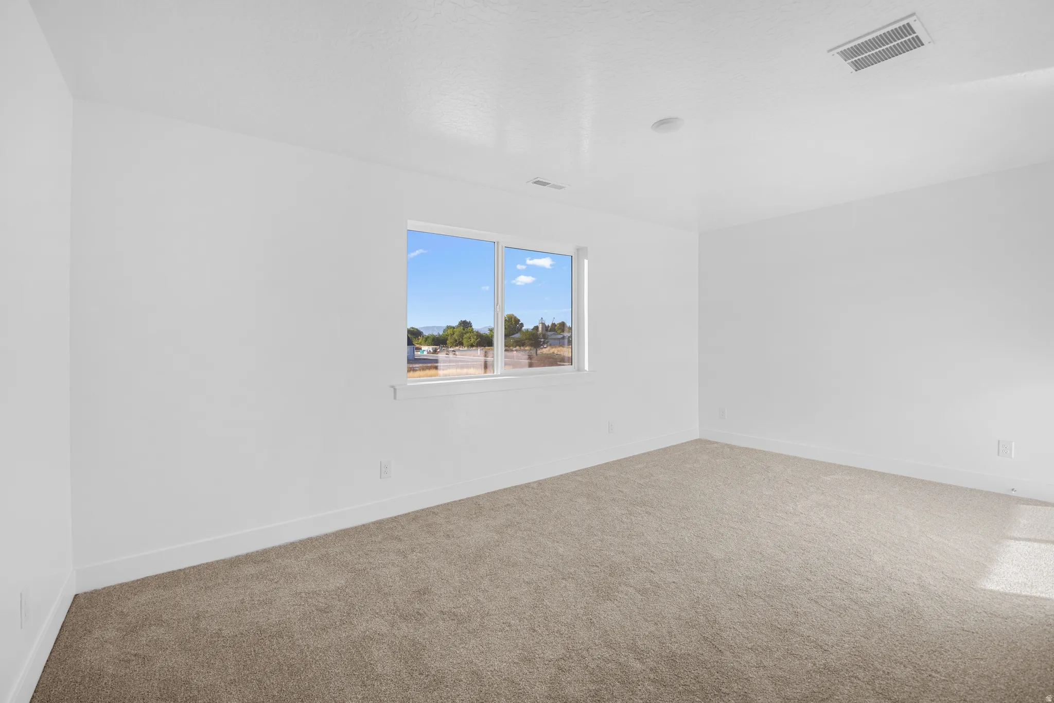 Neutral-toned carpeting paired with white walls