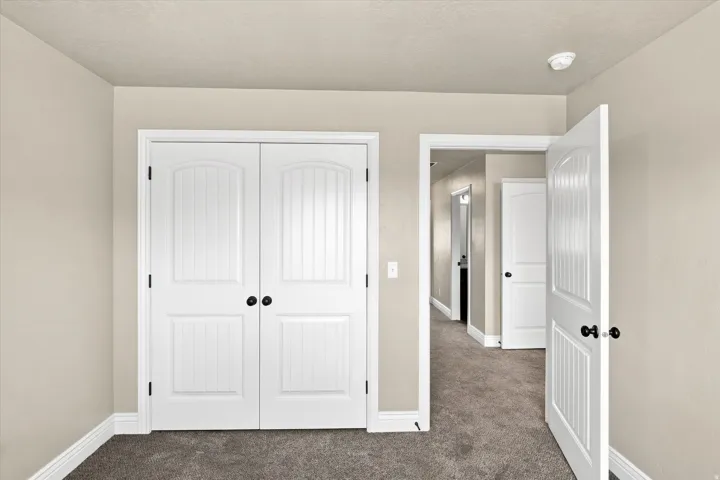 White paneled doors with black hardware
