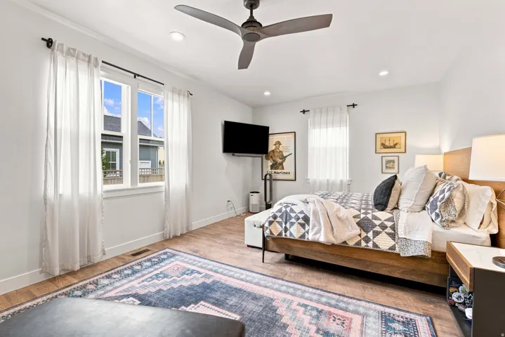 Recessed lighting, wood-finish flooring, ceiling fan, and large windows