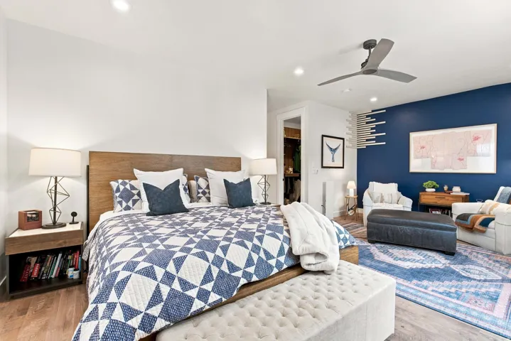 Wood-finish flooring, recessed lighting, and a ceiling fan