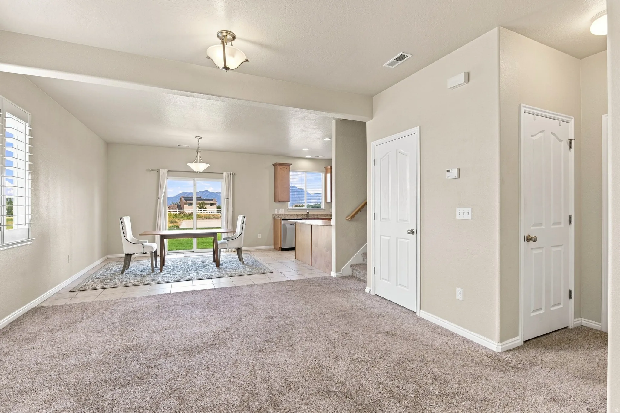 Wall-to-wall carpeting and neutral wall tones