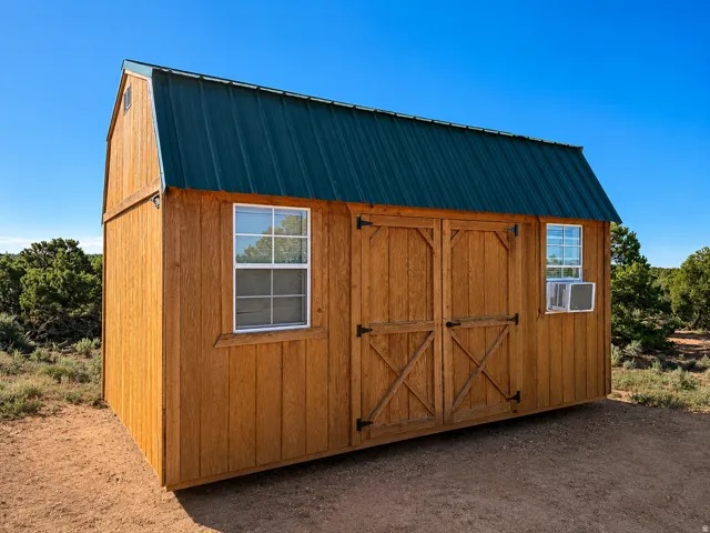 Wood-sided outbuilding with a green metal gambrel roof
