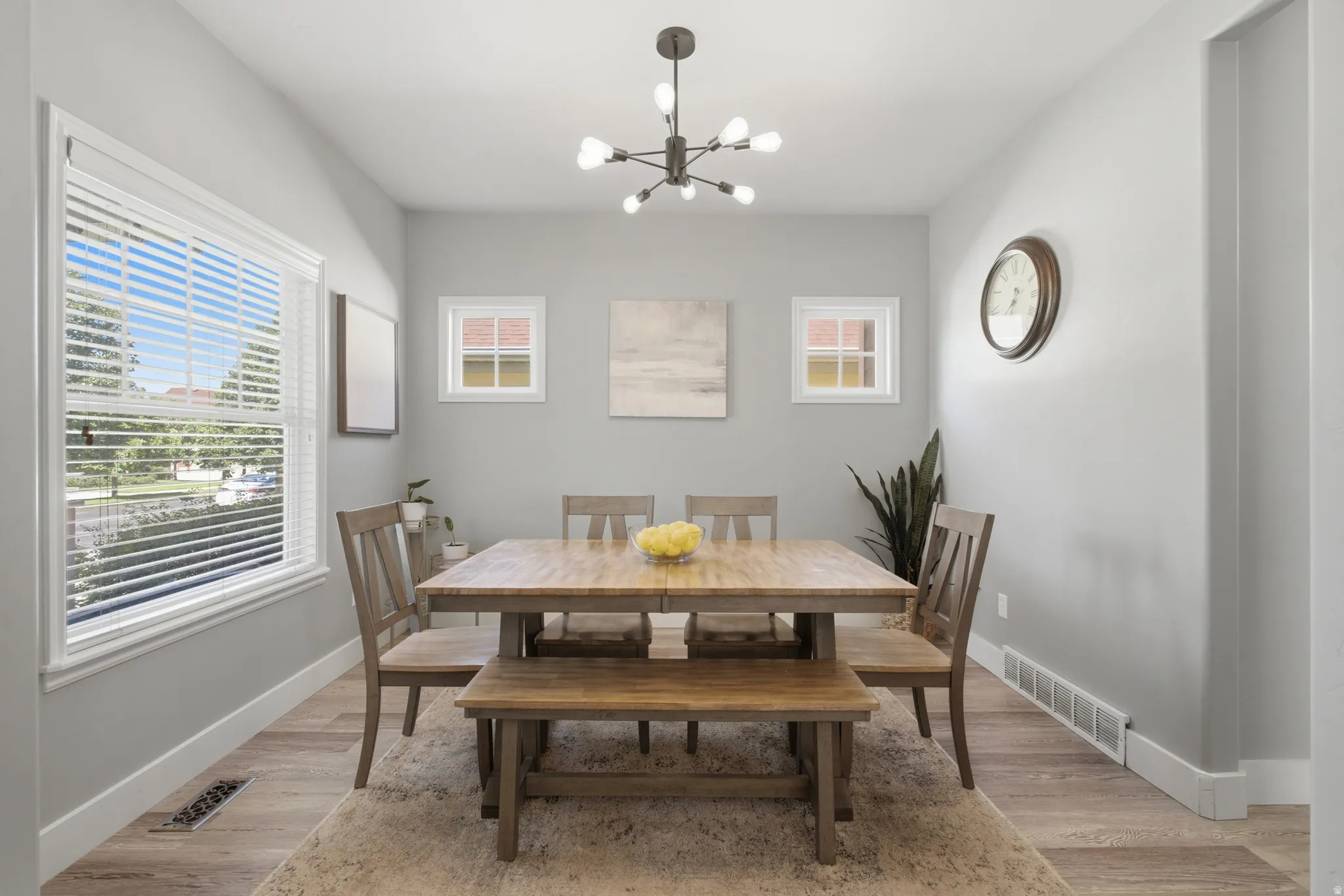 Light gray walls with wood-finish flooring