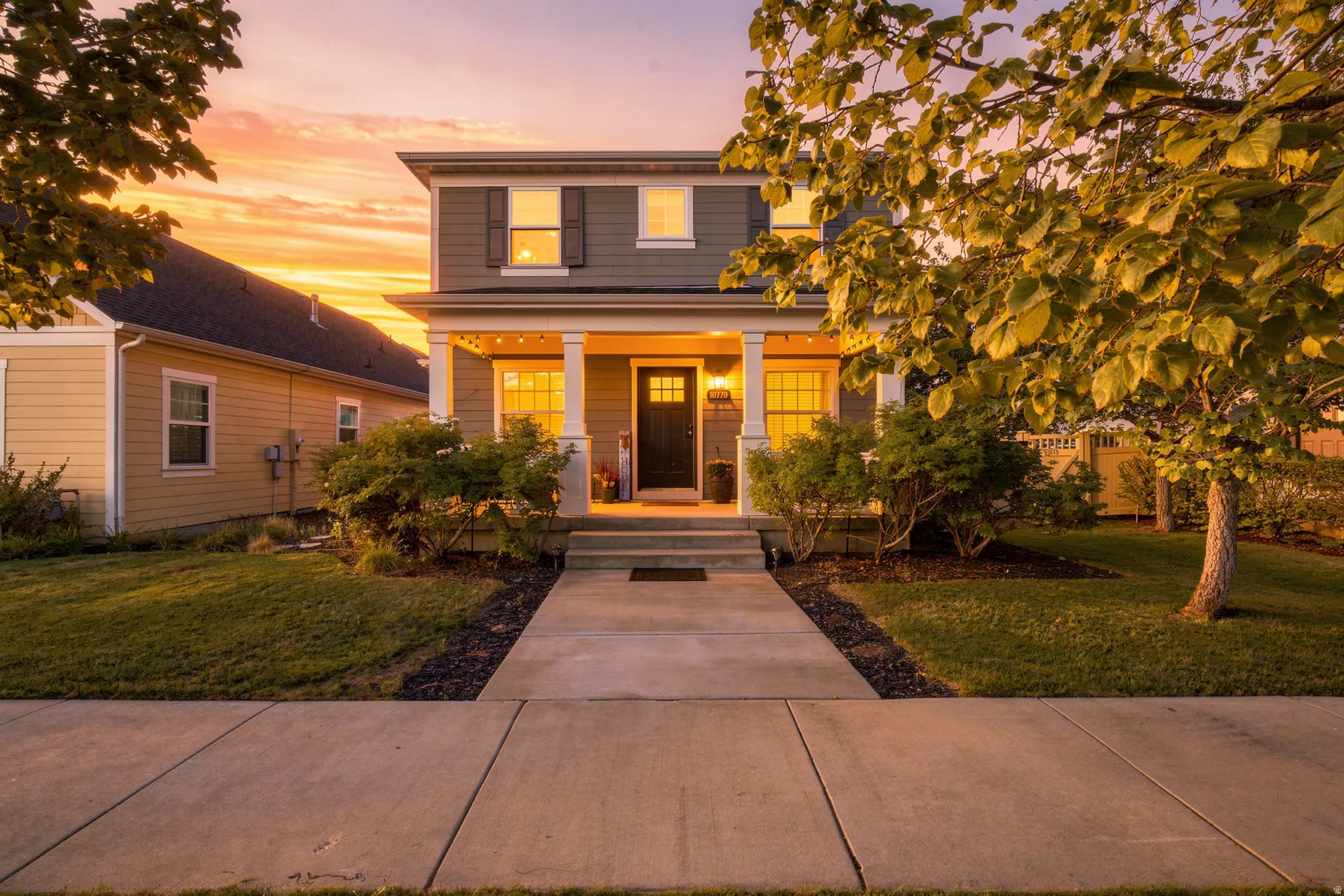 Two-story exterior with horizontal siding and decorative window shutters