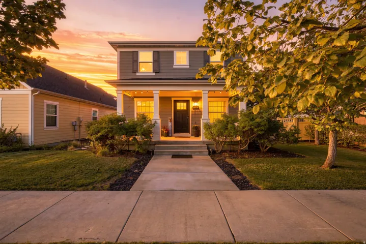 Two-story exterior with horizontal siding and decorative window shutters