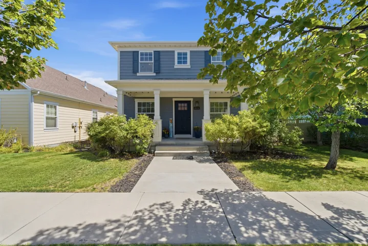 Two-story residence with blue siding and white trim