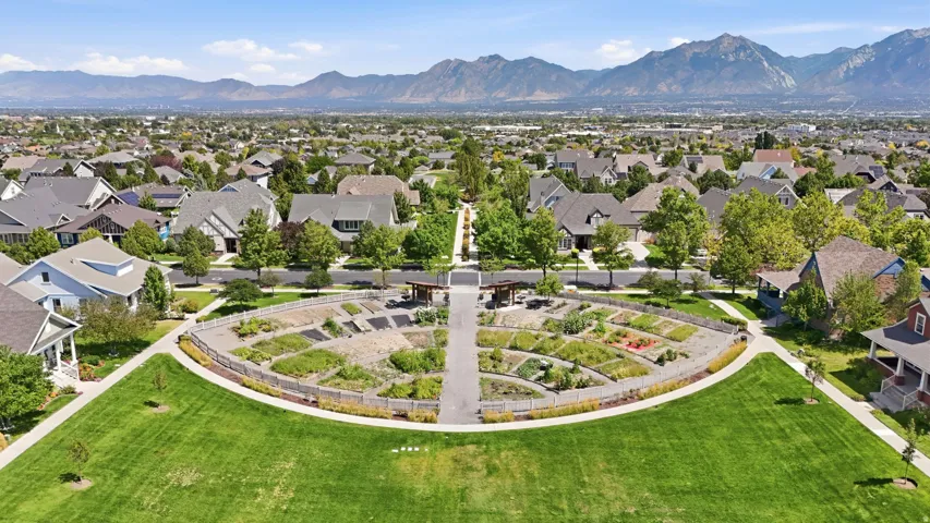 Eastlake Commons. Expansive green space featuring a curved walking path and mountain backdrop