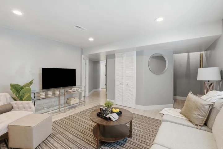 Recessed lighting, light-toned wood-finish flooring, white louvered closet doors, and light gray wall paint