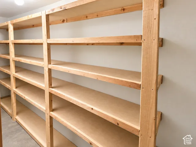 Built-in wood shelving with multiple tiers, offering ample storage capacity