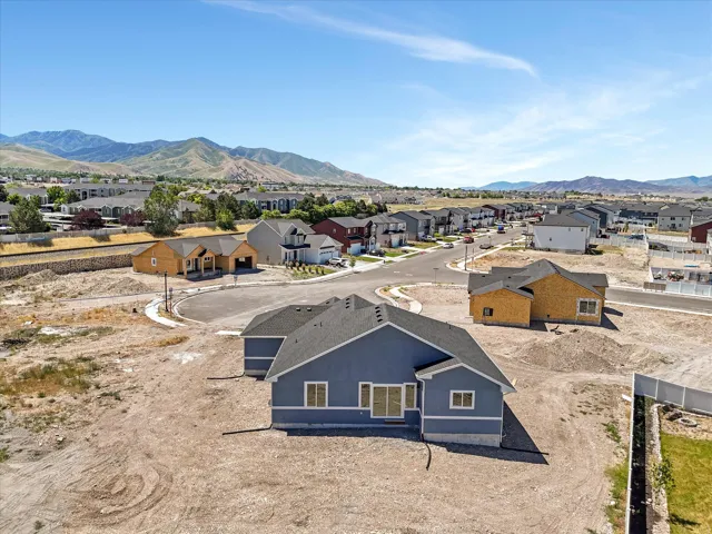 Residential street with a cul-de-sac and mountain backdrop