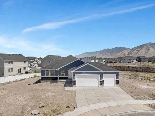 Contemporary exterior with a two-car garage and an additional single-car garage