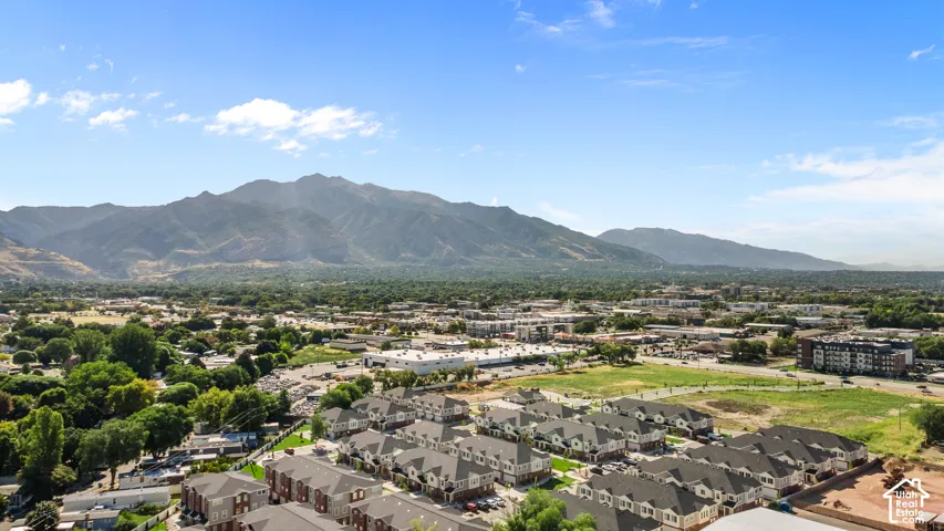 Expansive mountain backdrop with a developed residential area