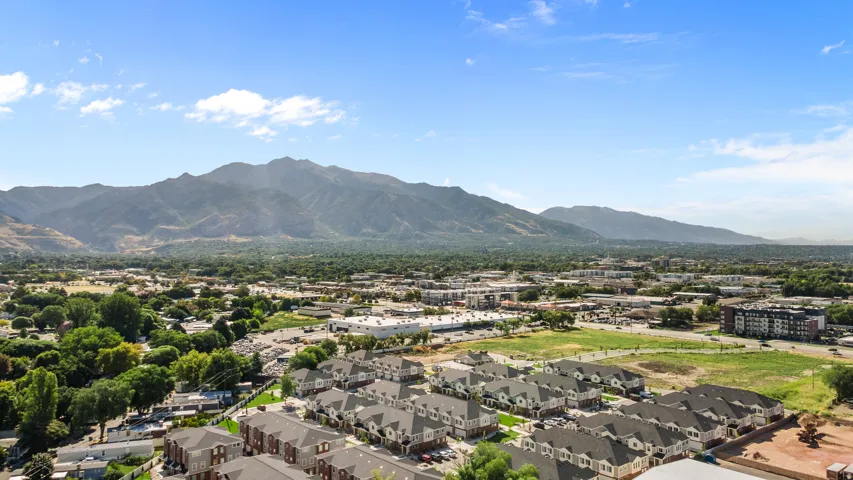 Expansive mountain backdrop with a developed residential area