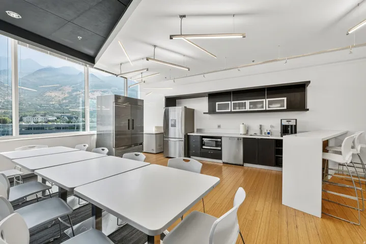 Expansive windows provide ample natural light and mountain scenery