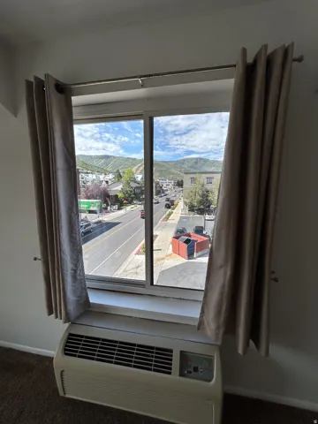 Window with a mountain backdrop