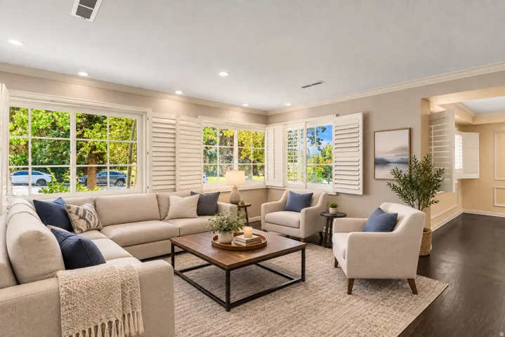 Dark wood-finish flooring, recessed lighting, and crown molding